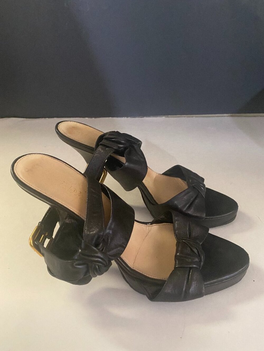 Prada Black Knotted Leather Slingback Heels with Gold Buckle